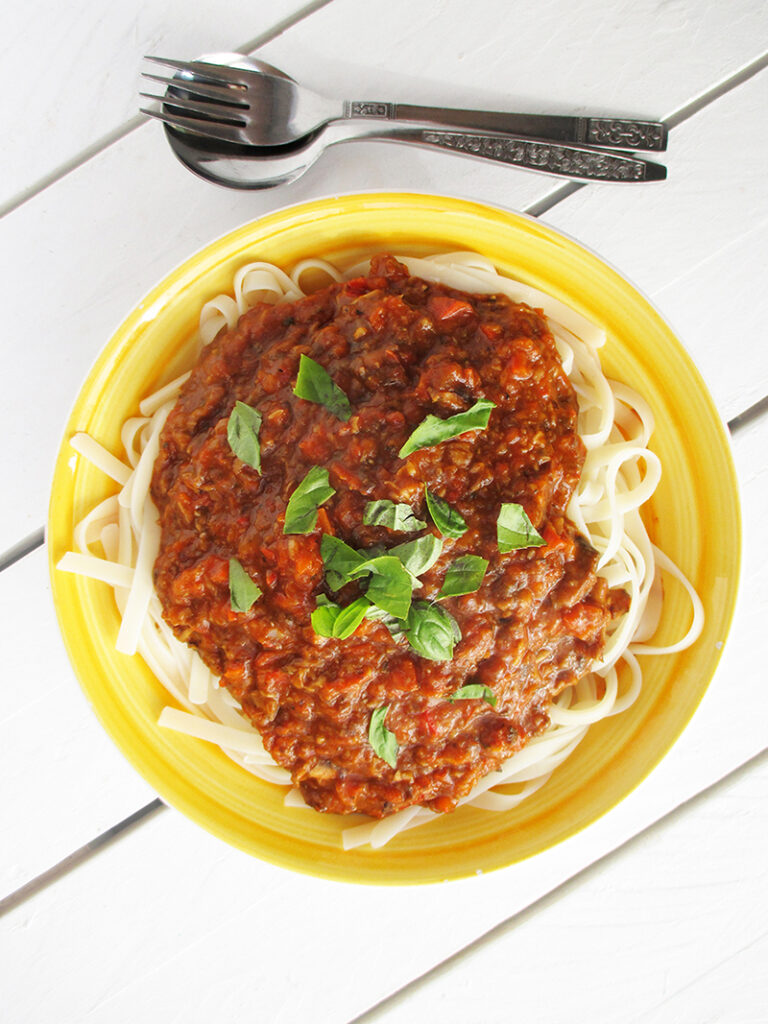 Chunky vegan Bolognese sauce with red peppers and herbs.