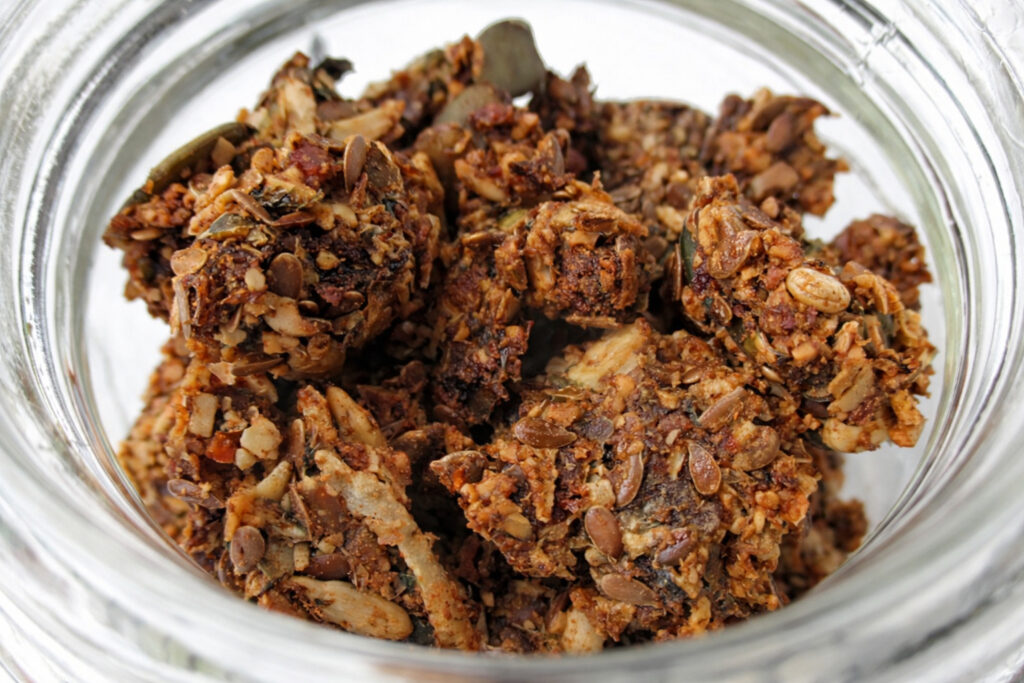 Vegan gluten-free muesli clusters with sunflower seeds, pumpkin seeds, coconut and cinnamon